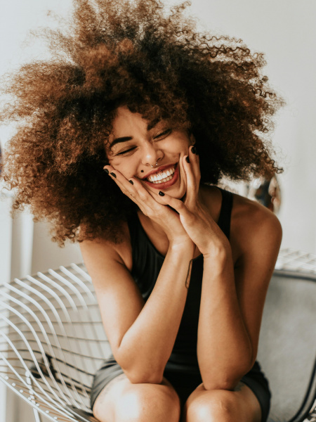 Lady laughing and holding her face